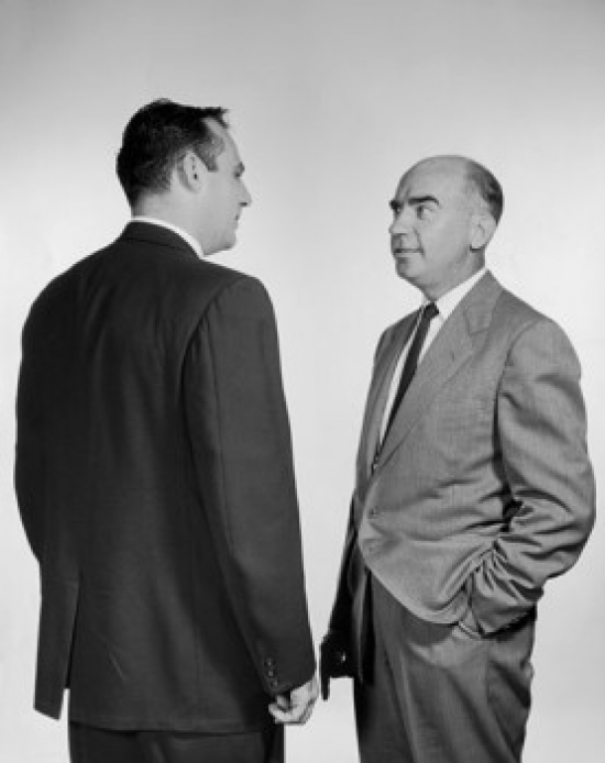 Two Businessmen Talking Poster Print - 18 x 24 in.