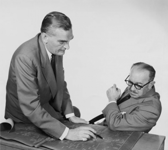 Side Profile of Two Architects Discussing on Blueprint Poster Print - 18 x 24 in.