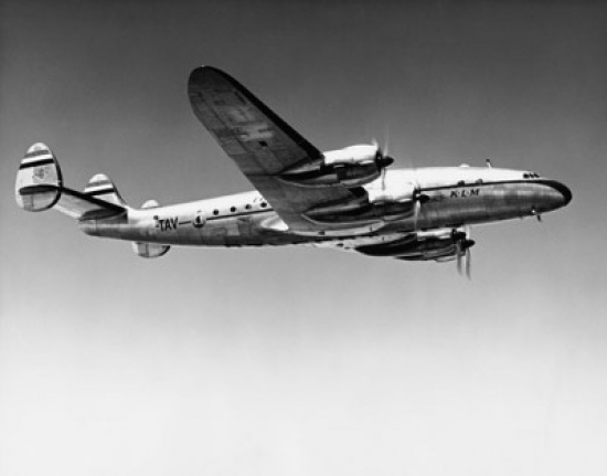 Low Angle View of an Airplane in Flight Poster Print - 18 x 24 in.