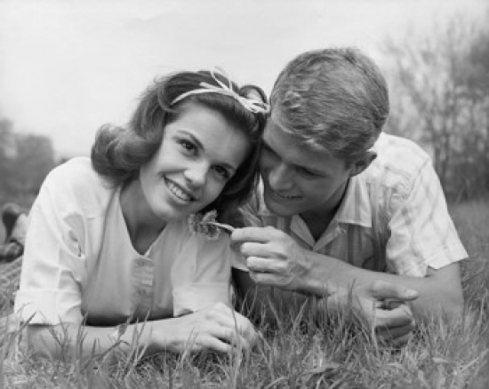 SAL2555871 Close-Up of a Teenage Couple Lying on Grass & Smiling Poster Print - 18 x 24 in.