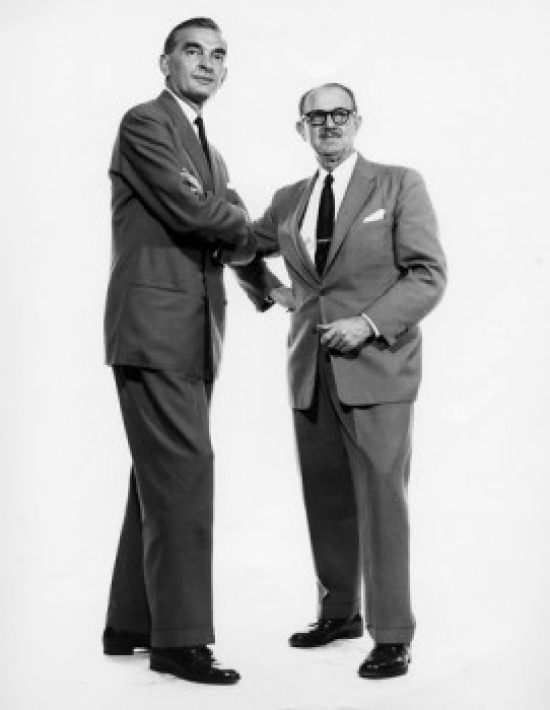 Two Businessmen Standing Together Poster Print - 18 x 24 in.