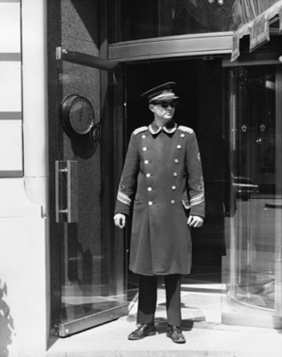Doorman Standing in a Doorway Poster Print
