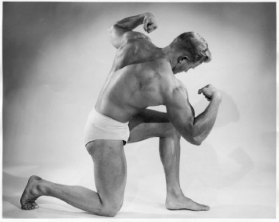 Side Profile of Young Man Flexing Muscles Poster Print - 18 x 24 in.