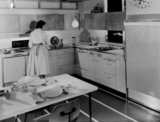 SAL2557762 Rear View of a Young Woman Preparing Food in a Kitchen Poster Print - 18 x 24 in.