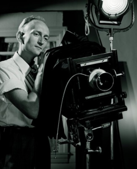 Man with Old Fashioned Camera in Studio Poster Print - 18 x 24 in.