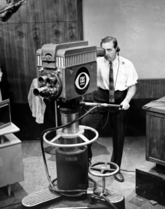 High Angle View of a Cameraman Operating a Television Camera Poster Print - 18 x 24 in.