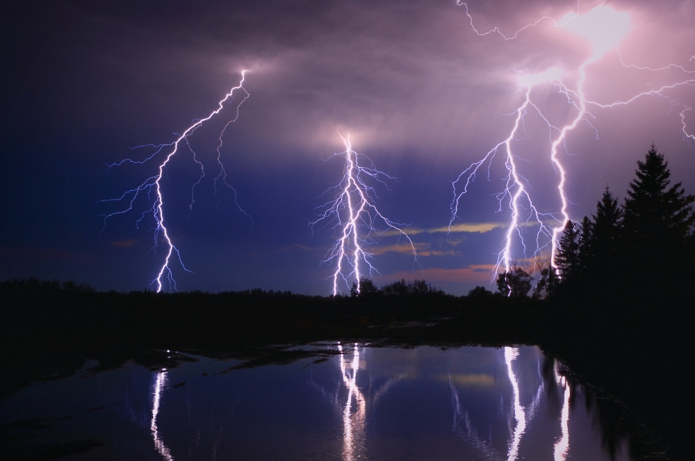 Lightning Storm Over A Lake Poster Print by Corey Hochachka, 17 x 11