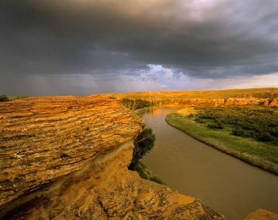Approaching Storm on the Milk River at Writing on Stone Provincial Park Alberta Canada Poster Print by Chuck Haney