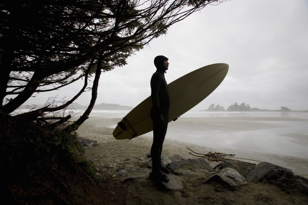 Surfer Observing Water from The Beach Poster Print by Deddeda - 17 x 11