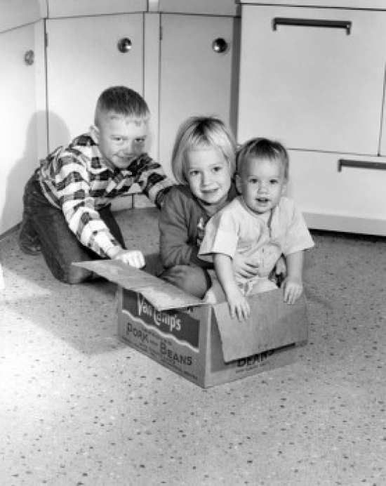 Children Playing with Cardboard Box in Kitchen Poster Print - 18 x 24 in.