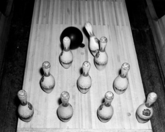 High Angle View of a Bowling Ball Knocking Down Bowling Pins Poster Print - 18 x 24 in.