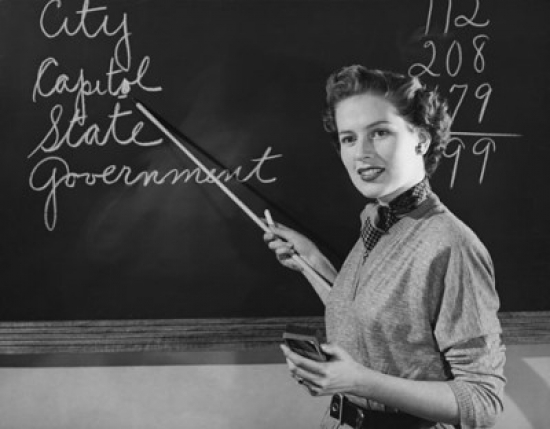 Teacher Pointing to a Blackboard Poster Print - 18 x 24 in.