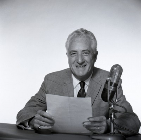 Senior Man Sitting Next to Microphone Poster Print - 18 x 24 in.