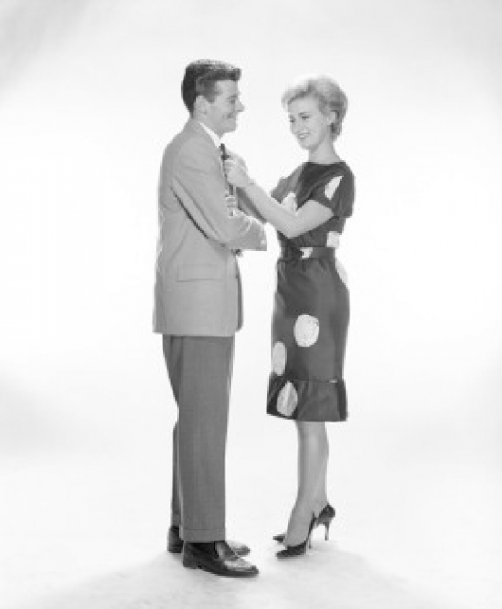 Woman Adjusting Mans Tie Poster Print - 18 x 24 in.