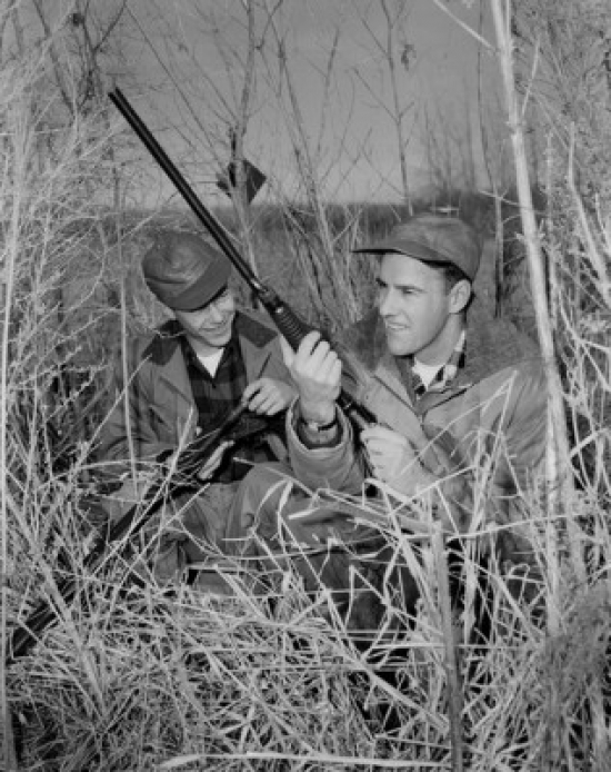 Two Hunters Hiding in Shrubs Poster Print - 18 x 24 in.
