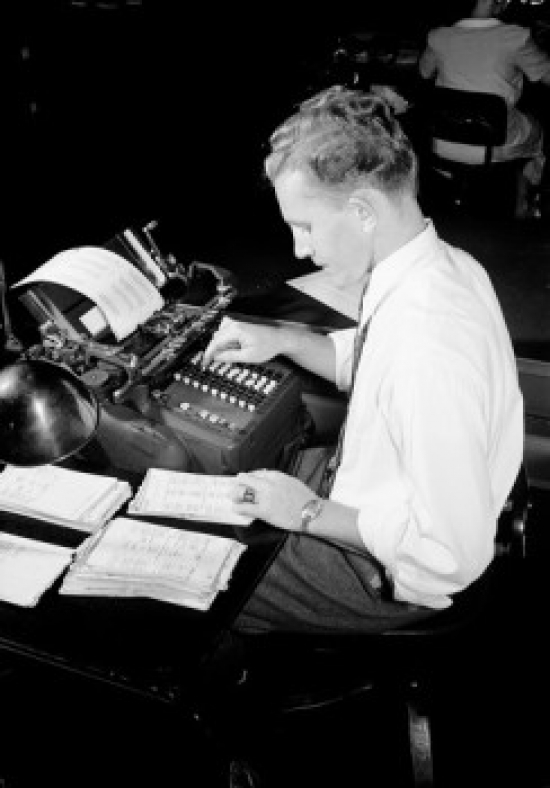 Man Doing Paperwork Using Counting Machine Poster Print - 18 x 24 in.