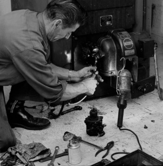 Mechanic Repairing Machine Poster Print - 18 x 24 in.