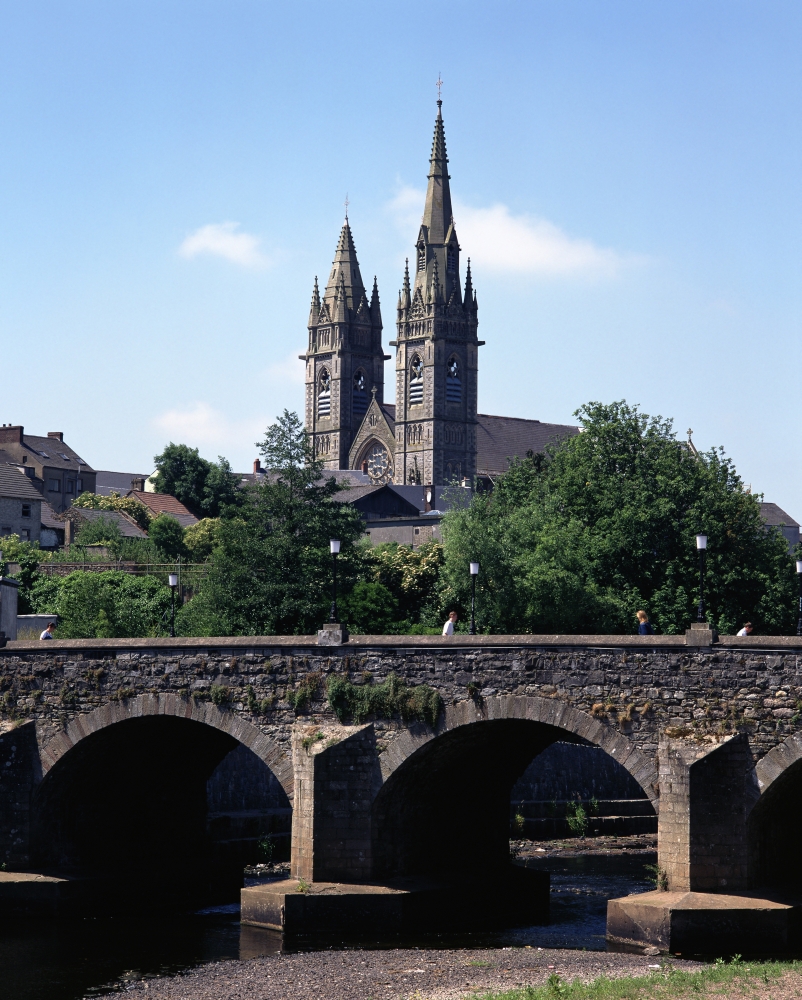 Arch Bridge Across A River with A Church in The Background Omagh County Tyrone Northern Ireland Poster Print by The Irish Image Collection, 12 x 16