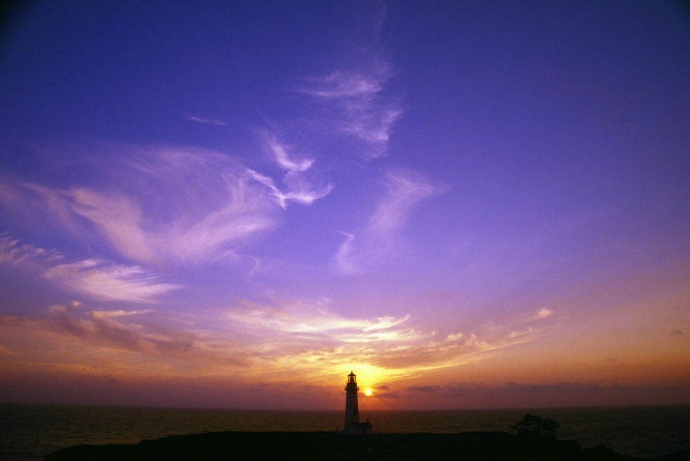 DPI1788418 Luminous Sky Behind Distant Lighthouse Poster Print by Natural Selection Craig Tuttle, 18 x 12