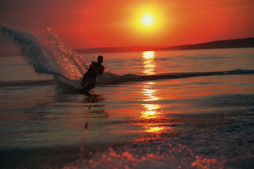 Waterskiing At Sunset Poster Print by Misty Bedwell, 34 x 22 - Large