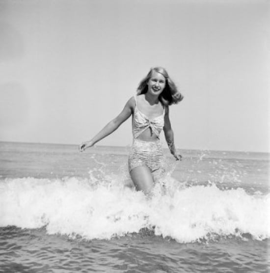 SAL255424527 Young Woman Wearing Bikini Wading in Sea Poster Print - 18 x 24 in -  Posterazzi