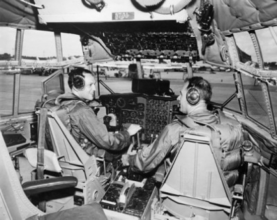 Rear View of Two US Air Force Pilots Sitting in the Cockpit of an Aircraft Poster Print - 18 x 24 in.