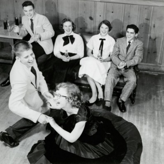 SAL2554740 Teenage Couple Dancing at a Party with Two Teenage Couples Sitting Behind Them Poster Print - 18 x 24 in.