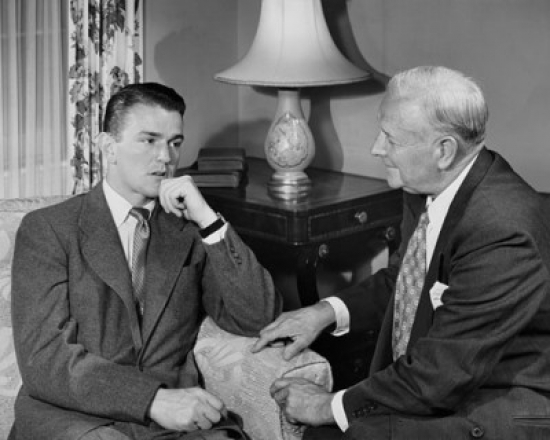 Two Businessmen Talking Indoors Poster Print - 18 x 24 in.