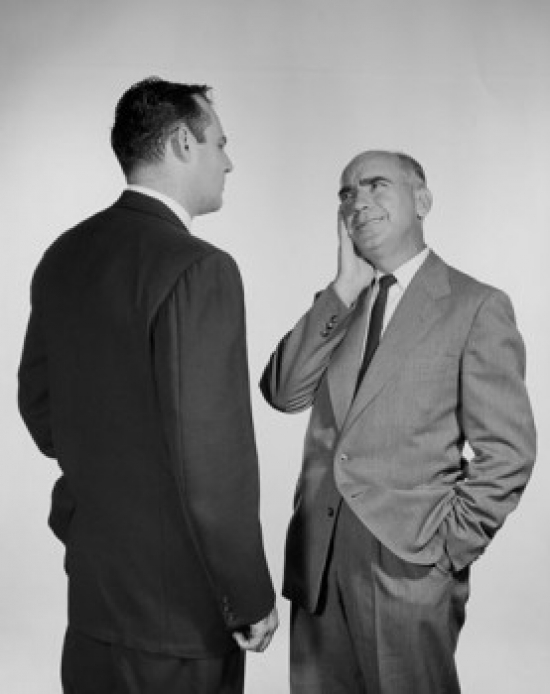 Two Businessmen Talking Poster Print - 18 x 24 in.