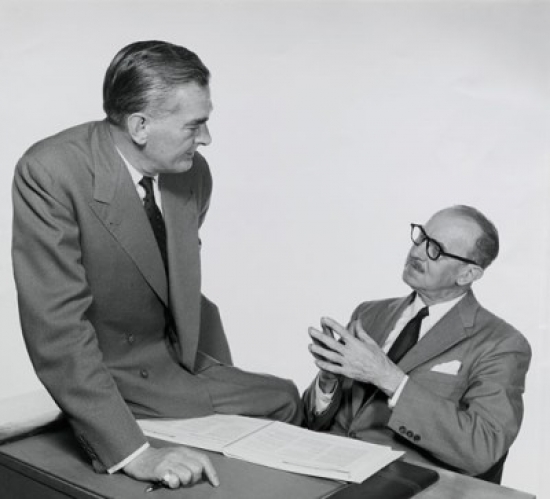 Two Businessmen Talking Poster Print - 18 x 24 in.