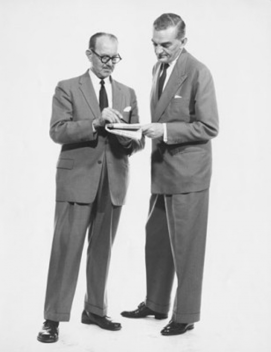 Two Businessmen Reading Newspaper Poster Print - 18 x 24 in.