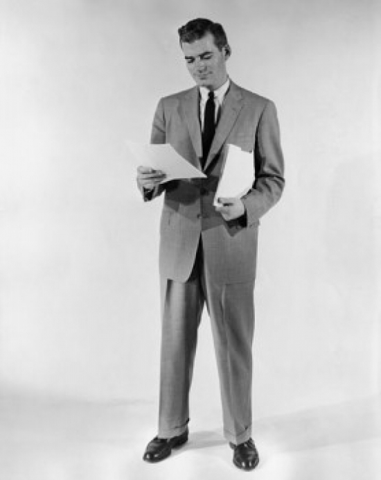 Businessman Reading Document Poster Print - 18 x 24 in.