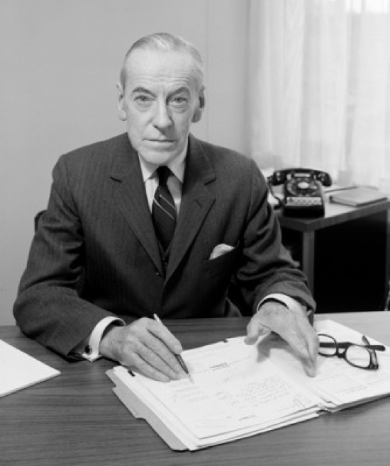 Senior Businessman Signing Documents Poster Print - 18 x 24 in.
