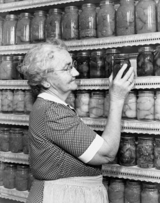 SAL25549200 Senior Woman Choosing a Jar of Pickled Vegetables Poster Print - 18 x 24 in.