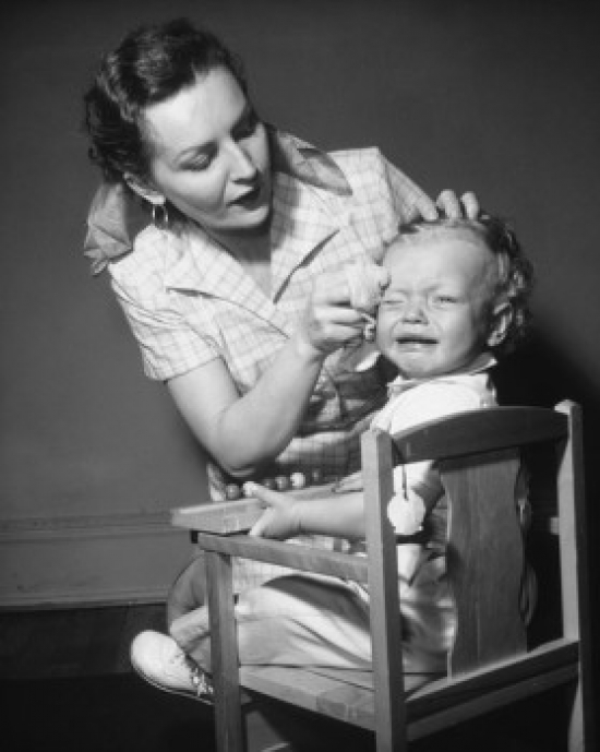 Mother Wiping Her Sons Forehead Poster Print - 18 x 24 in.