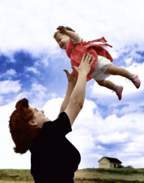 Side Profile of a Mother Tossing Her Daughter in the Air Poster Print - 18 x 24 in.