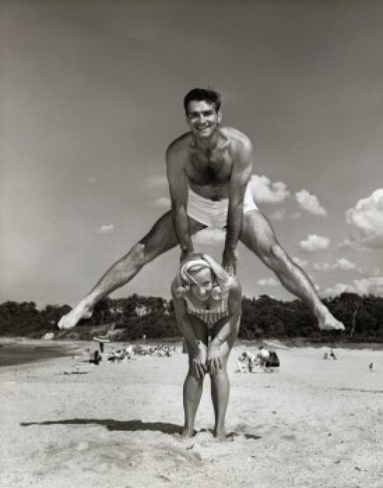 SAL2556620 Portrait of a Young Couple Playing Leapfrog on the Beach Poster Print - 18 x 24 in.