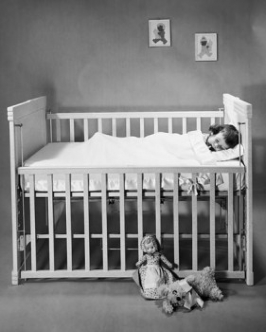 Baby Sleeping in a Crib Poster Print - 18 x 24 in.
