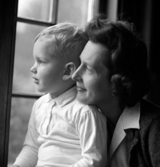 Mother & Son Looking Through Window Poster Print - 18 x 24 in.