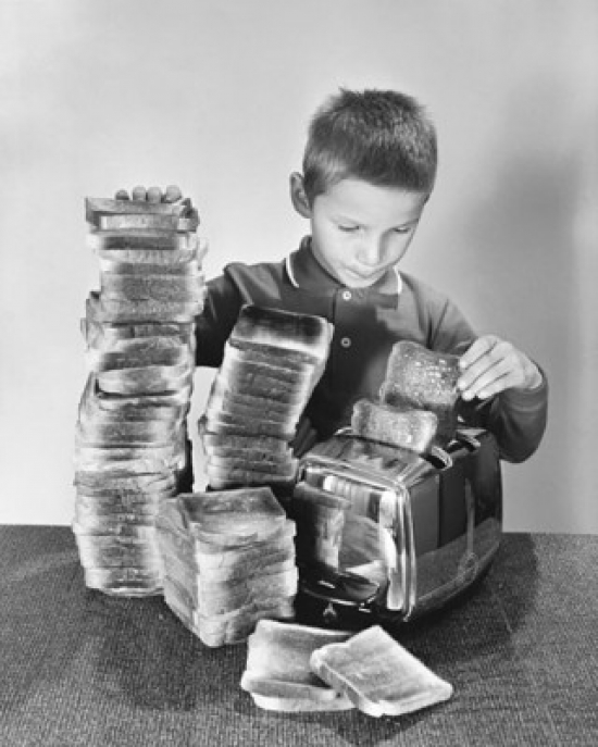 Boy Toasting Bread in a Toaster Poster Print - 18 x 24 in.