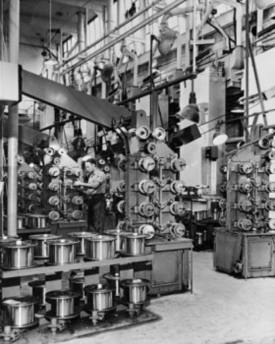 Technician Working in a Factory Poster Print - 18 x 24 in.