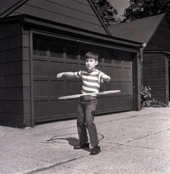 Boy Playing with Plastic Hoop Poster Print - 18 x 24 in.