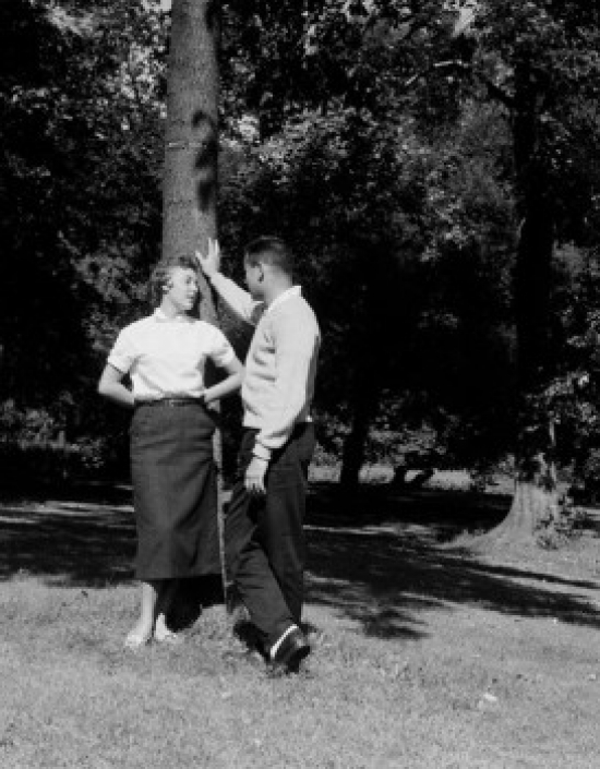 Young Couple Talking in Park Poster Print - 18 x 24 in.