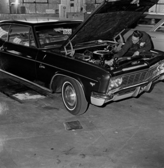 Auto Mechanic at Work Poster Print - 18 x 24 in.