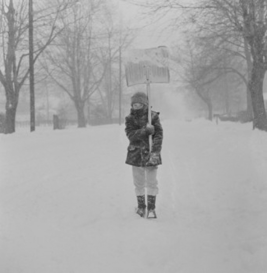 Boy with Snow Shovel in Blizzard Poster Print - 18 x 24 in.
