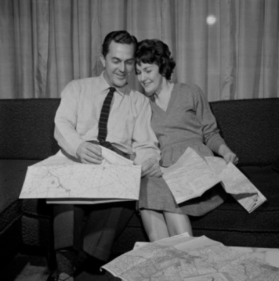 Mature Couple Reading Maps Poster Print - 18 x 24 in.
