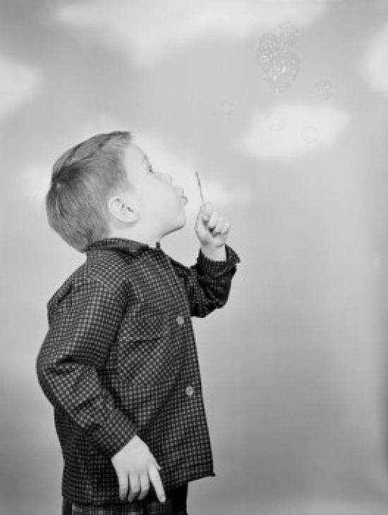 Boy Blowing Bubbles Poster Print - 18 x 24 in.