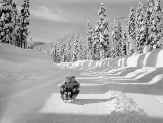Young Couple Riding Sledge Poster Print - 18 x 24 in.