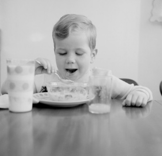 Boy Eating Breakfast Cereal Poster Print - 18 x 24 in.