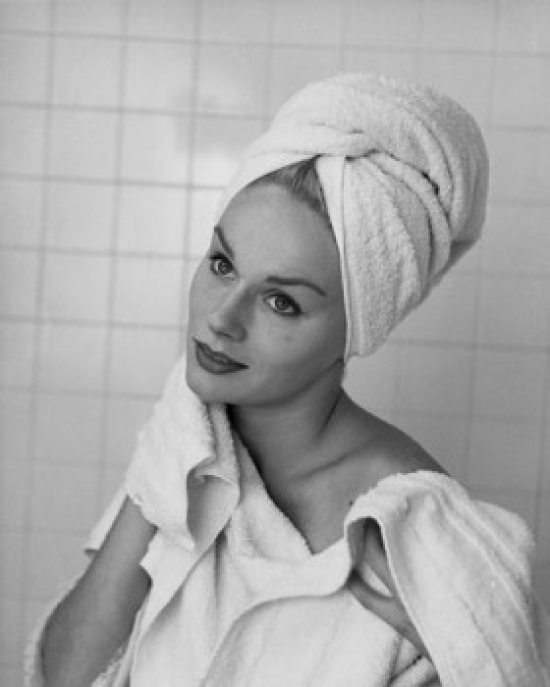 Close-Up of a Young Woman Drying Her Neck with a Towel Poster Print - 18 x 24 in.